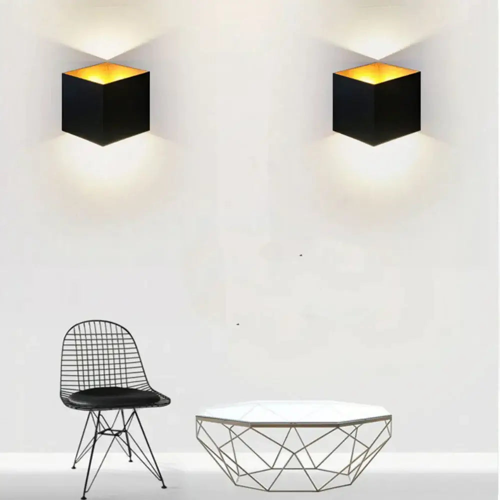 Modern matte black dual-head wall light with black cube-shaped sconces and warm amber interior lighting for outdoor decorbites dual-head wall lamp