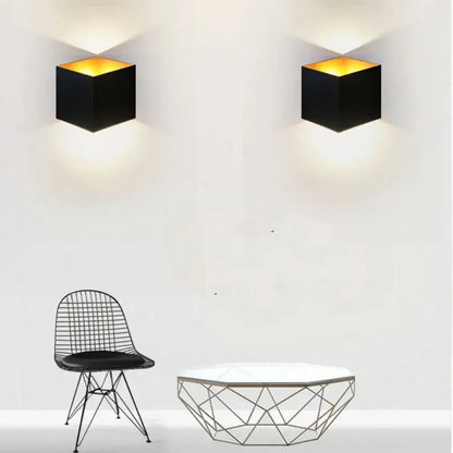 Modern matte black dual-head wall light with black cube-shaped sconces and warm amber interior lighting for outdoor decorbites dual-head wall lamp