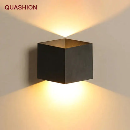 Modern matte black dual-head wall light by quashion with a black matte finish emitting warm directional light decorbites wall lamp