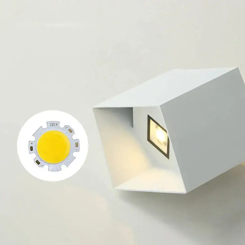 White cube-shaped wall light with recessed square fixture emitting warm light for modern outdoor decorbites dual-head wall lamp