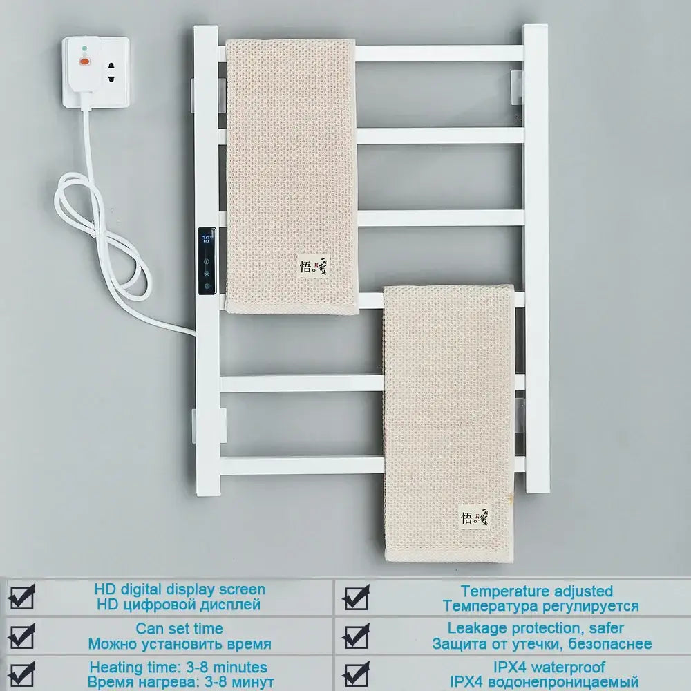 Modern white electric towel warmer with digital display and two beige textured towels hanging on matte black frame