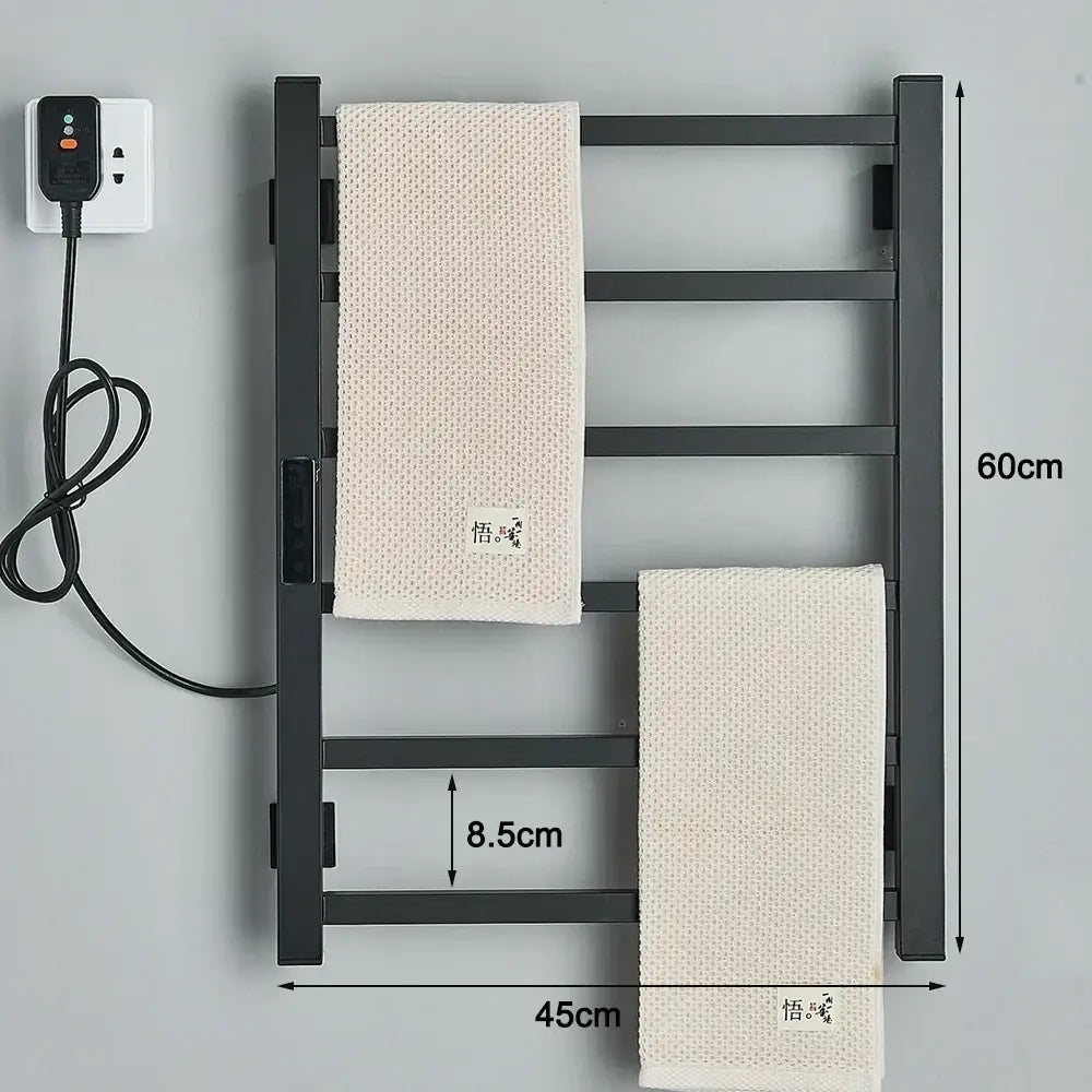 Modern matte black electric towel warmer with four bars and beige towels featuring a digital display