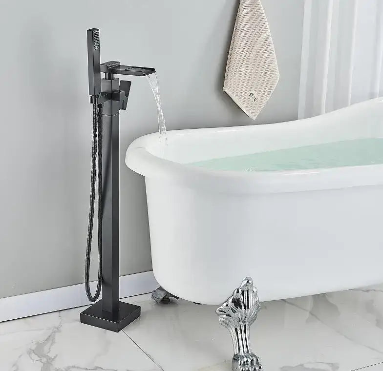 Modern matte black floor mounted bathtub faucet with black matte finish and integrated handheld showerhead by decorbites