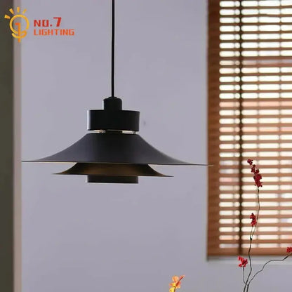 Modern flying saucer pendant light in matte black with layered conical shades for dining room decorbites modern flying