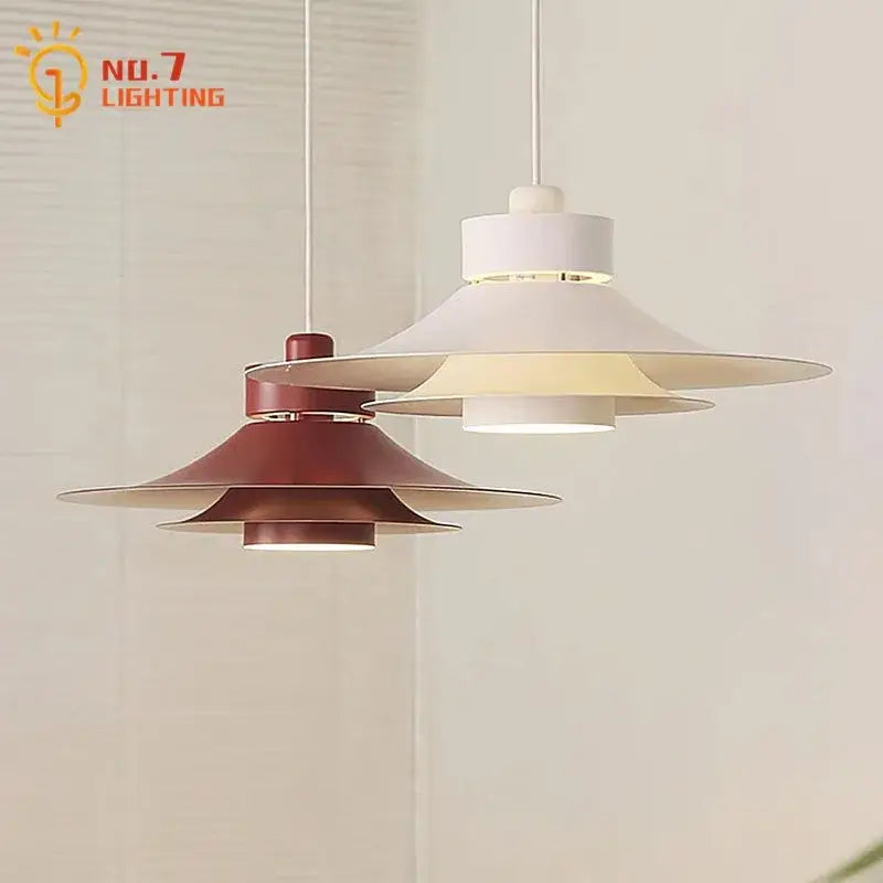Modern matte black flying saucer pendant light with white and terracotta tiered shades and sleek metal accents for dining room decorbites modern flying