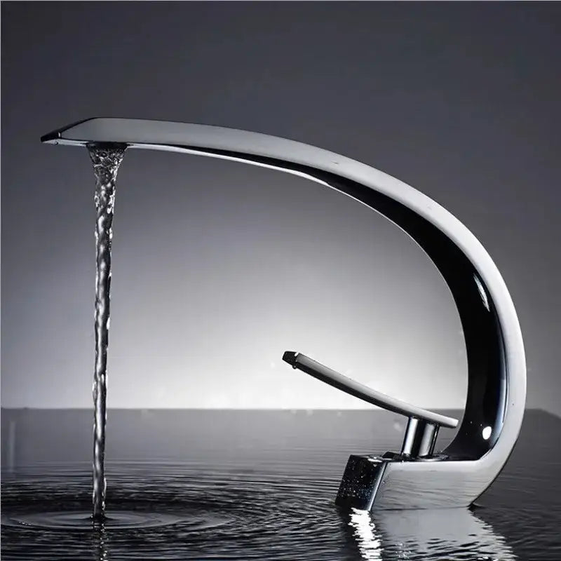 Modern matte black and gold basin faucet with chrome-finished waterfall spout and sleek single lever handle