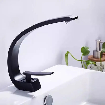 Modern matte black and gold modern basin faucet with sleek curved design in a bathroom basin faucet setup