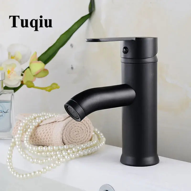 Modern matte black and gold single handle wash basin faucet with curved spout decorbites black single design