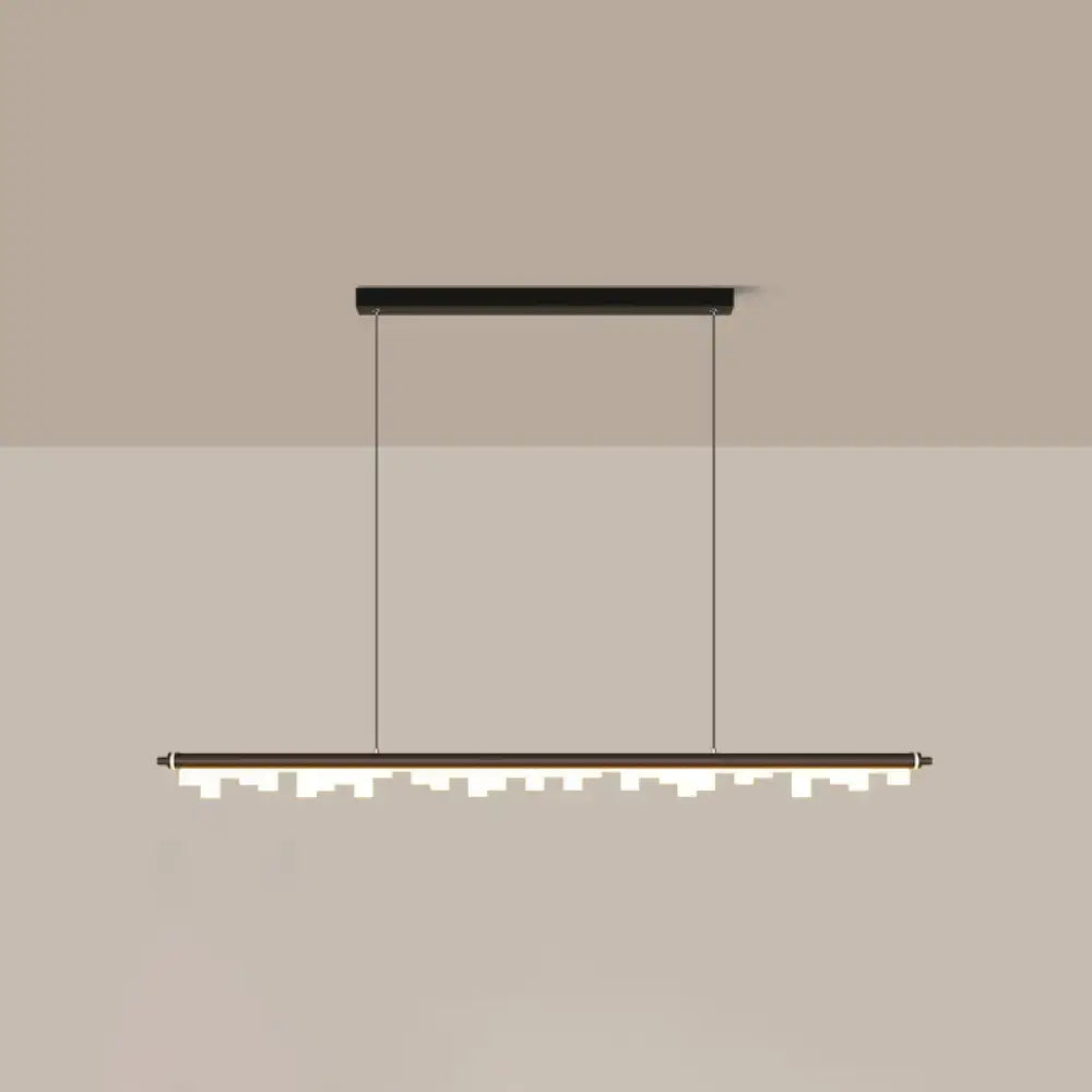 Modern matte black led island light with acrylic shade and chain cord length casting a warm white third glow
