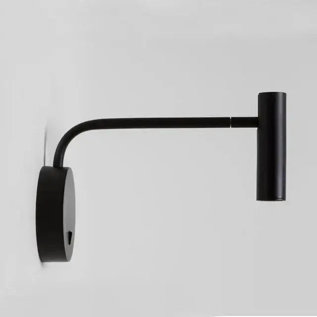 Modern matte black led wall lights with a curved arm and cylindrical head for bedroom reading use