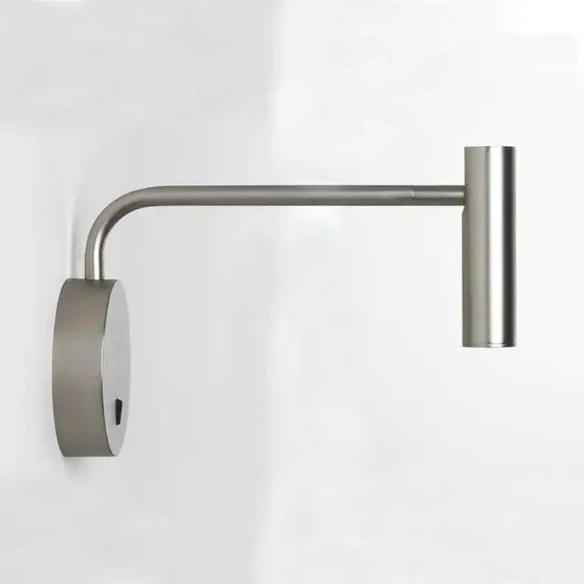 Modern brushed stainless steel wall lights with a sleek curved arm and cylindrical led light head for reading use