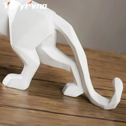 White geometric cat figurine with angular faceted design and smooth surface in decorbites leopard geometric resin statue style