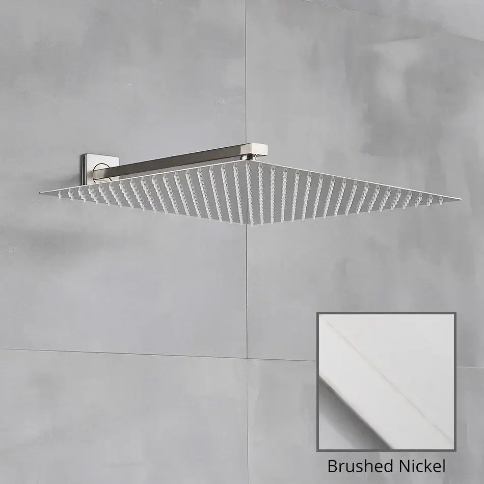 Brushed nickel square shower head with sleek modern design and wall arm for luxury rain shower in bathroom