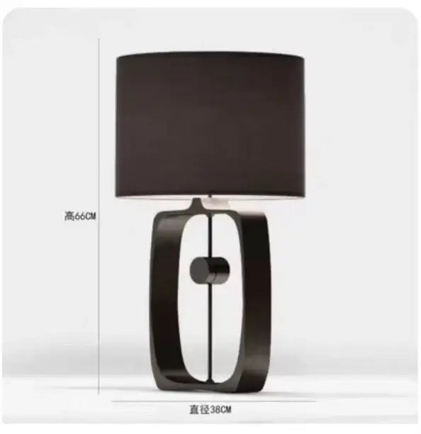 Modern matte black metal table lamp with fabric shade and open rectangular base for living room by decorbites designer