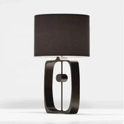 Modern matte black metal table lamp with cylindrical fabric shade for living room decor by decorbites designer