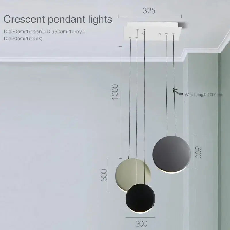 Modern matte black and muted green decorbites crescent moon chandelier with sleek circular shades for dining room decor