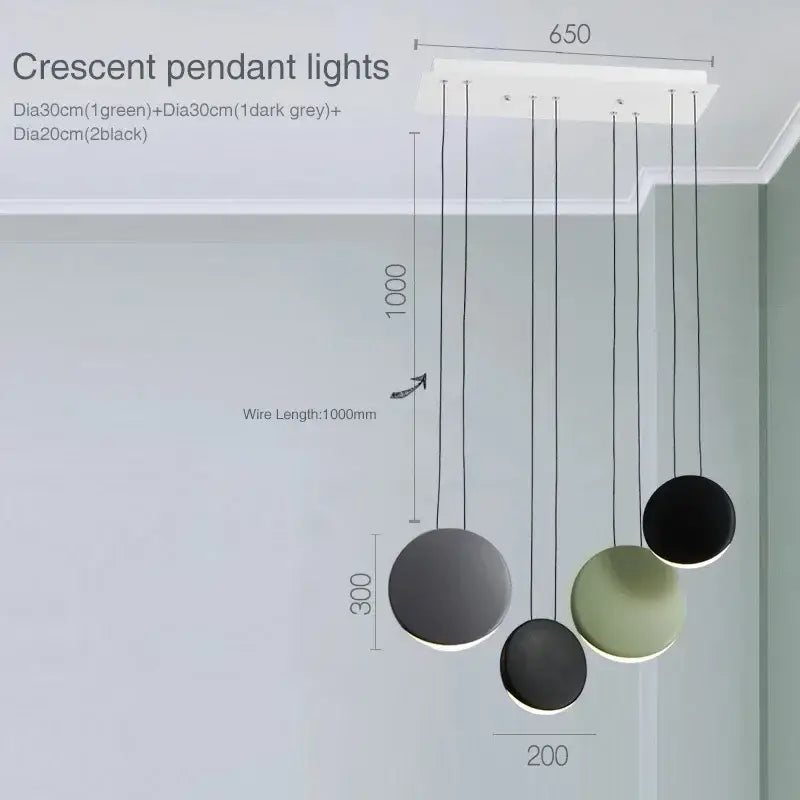 Modern matte black and muted green crescent moon chandelier with three spherical shades for dining room decorbites crescent moon