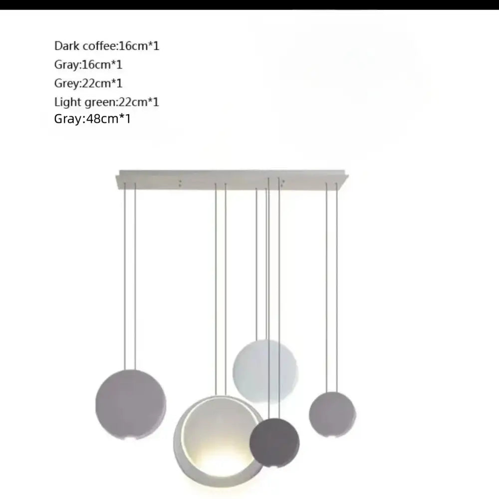 Modern matte black and muted green crescent moon chandelier with spherical pendant shades in dark coffee gray and light green tones by decorbites crescent moon