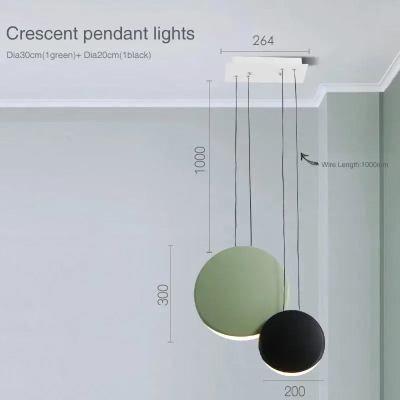 Modern matte black and muted green crescent moon chandelier with minimalist circular shades by decorbites crescent moon decor