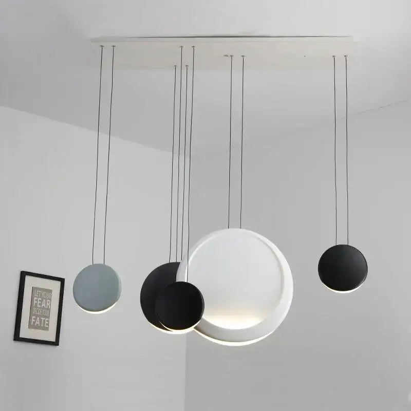 Modern matte black and muted green crescent moon chandelier with multiple circular shades by decorbites crescent moon decor