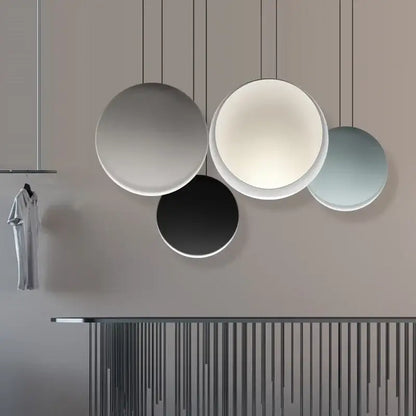 Modern matte black and muted green crescent moon chandelier with circular matte shades in gray white black and blue decorbites crescent moon