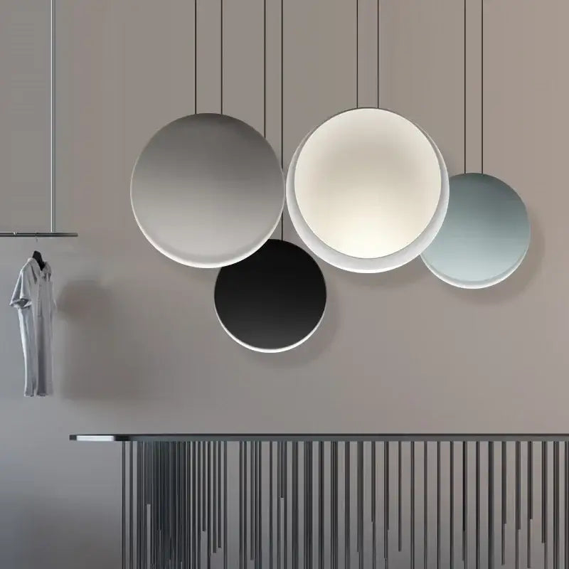 Modern matte black and muted green crescent moon chandelier with circular matte shades in gray white black and blue decorbites crescent moon