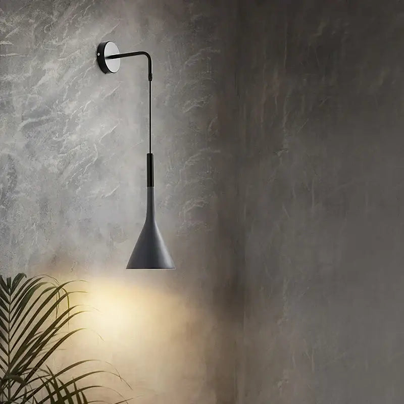 Modern matte black nordic led wall light with sleek curved arm and conical shade ideal for bedroom reading decorbites black nordic