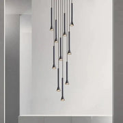 Modern matte black nordic pendant lamp with slender cylindrical shades and warm lighting for living room staircase