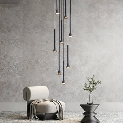 Modern matte black nordic pendant lamp with sleek tapered design hanging in a cascading arrangement for living room staircase