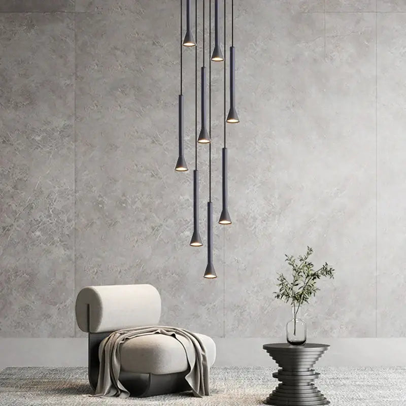 Modern matte black nordic pendant lamp with sleek tapered design hanging in a cascading arrangement for living room staircase