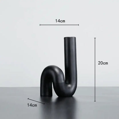 Black matte ceramic vase with sleek modern u-shaped twist knot design for decorbites black pipe geometric decor