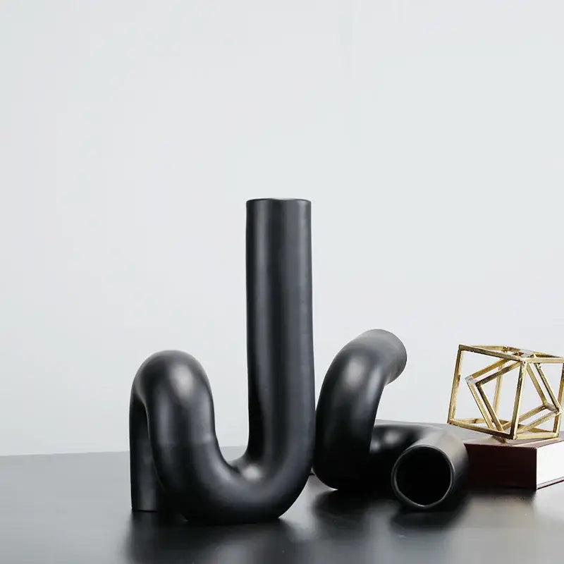 Modern matte black pipe geometric ceramic twist knot vase with curved u shaped form for living room decorbites decor