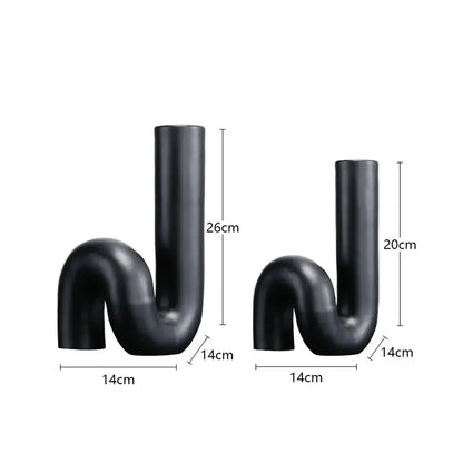 Two matte black ceramic vases with s-shaped twist knot design in black pipe geometric style for modern decorbites decor