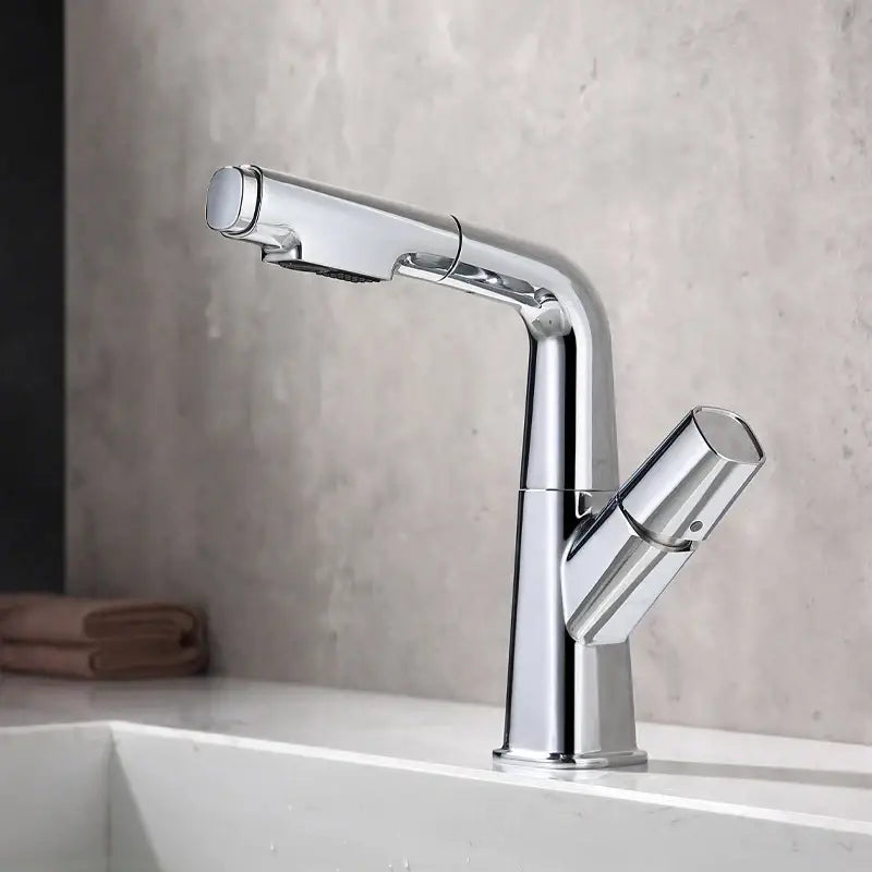 Modern chrome-finished decorbites brass basin faucet with sleek angular design and integrated spray head cold mixer