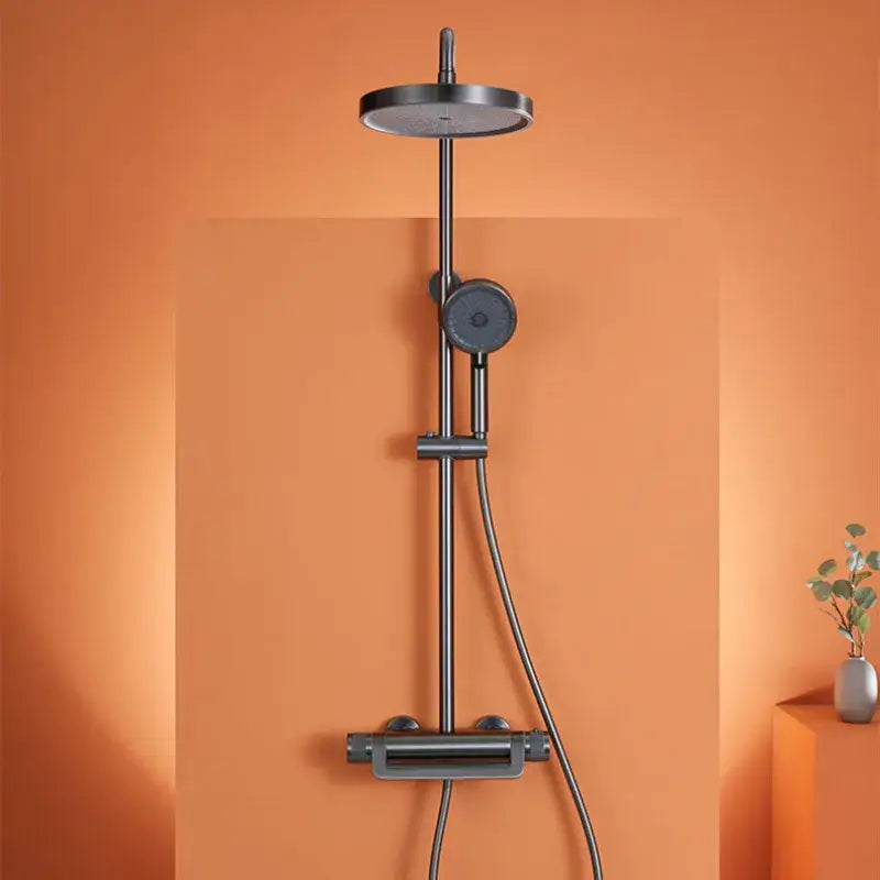 Modern matte black rainfall shower faucet set featuring a round rainhead and handheld nozzle shower faucet set