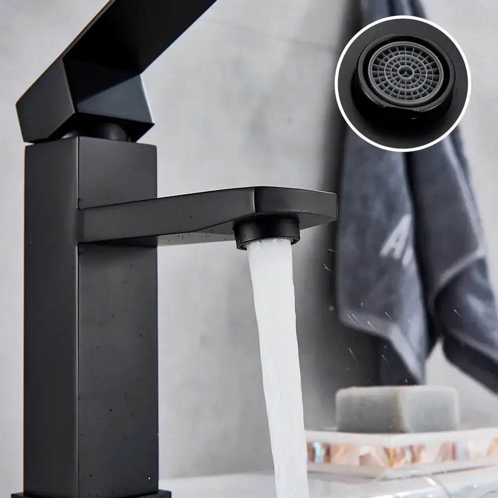Modern matte black rectangular basin faucet with sleek geometric design and flowing water stream by decorbites basin faucet