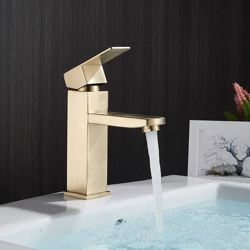 Modern gold-toned decorbites basin faucet with sleek geometric design and brushed finish for bathroom sink mixer