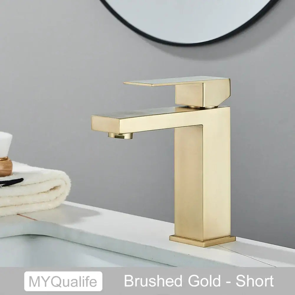Modern matte black rectangular basin faucet mixer featuring a brushed gold short faucet with sleek modern design