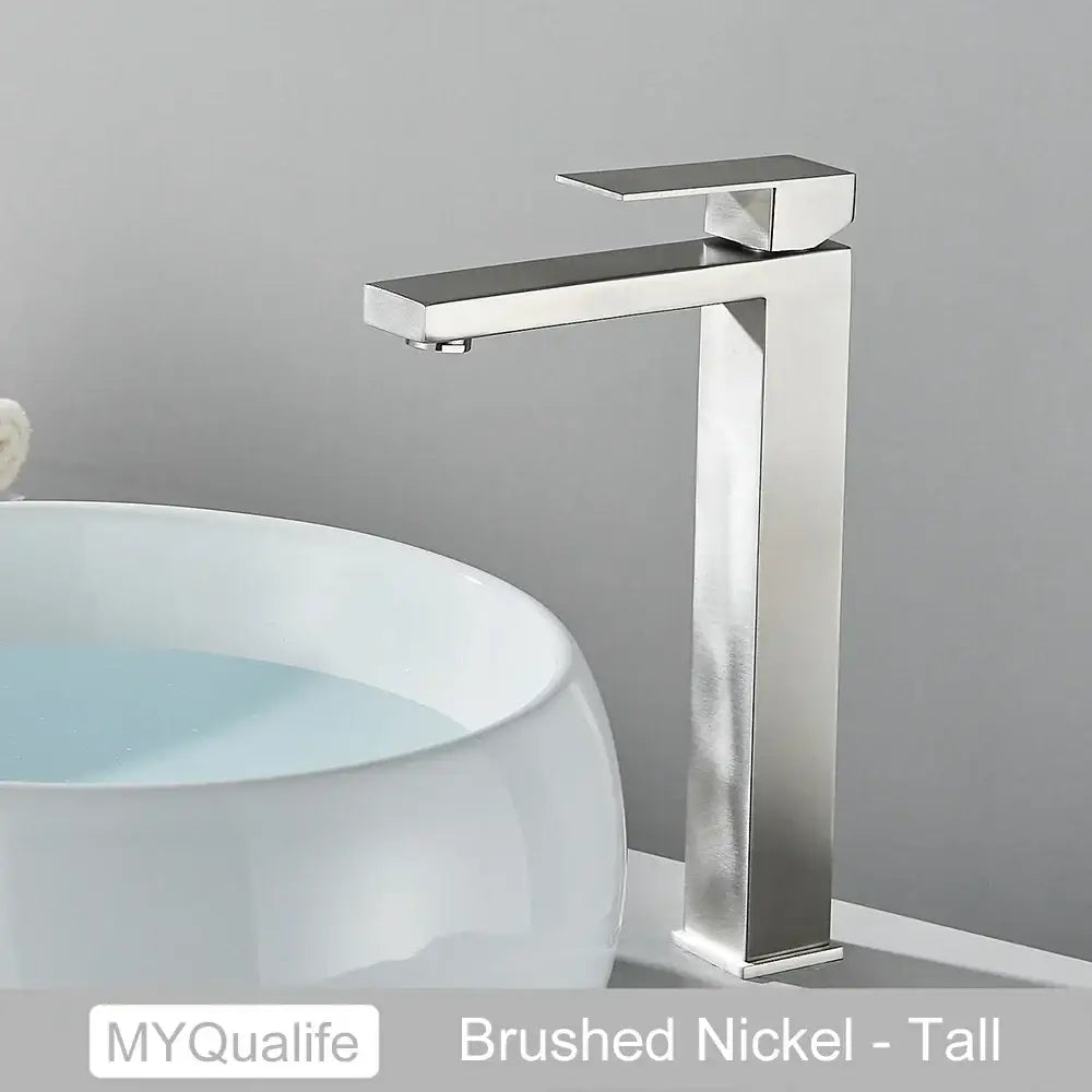 Modern matte black rectangular basin faucet mixer with a brushed nickel tall faucet and sleek modern design