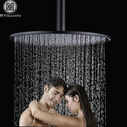 Modern matte black round brass shower head with a sleek design and multiple water jets for a rain shower experience