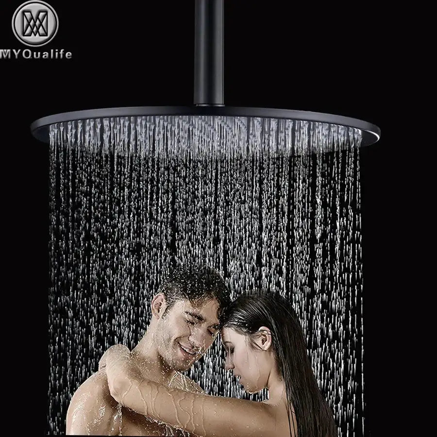 Modern matte black round brass shower head with a sleek design and multiple water jets for a rain shower experience