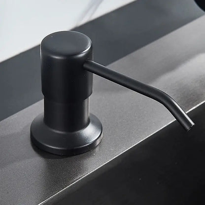 Modern matte black soap dispenser with stainless steel head featuring a sleek design for kitchen use