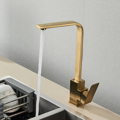 Modern gold-toned kitchen faucet with sleek angular design and brushed metal finish for decorbites black square kitchen decor