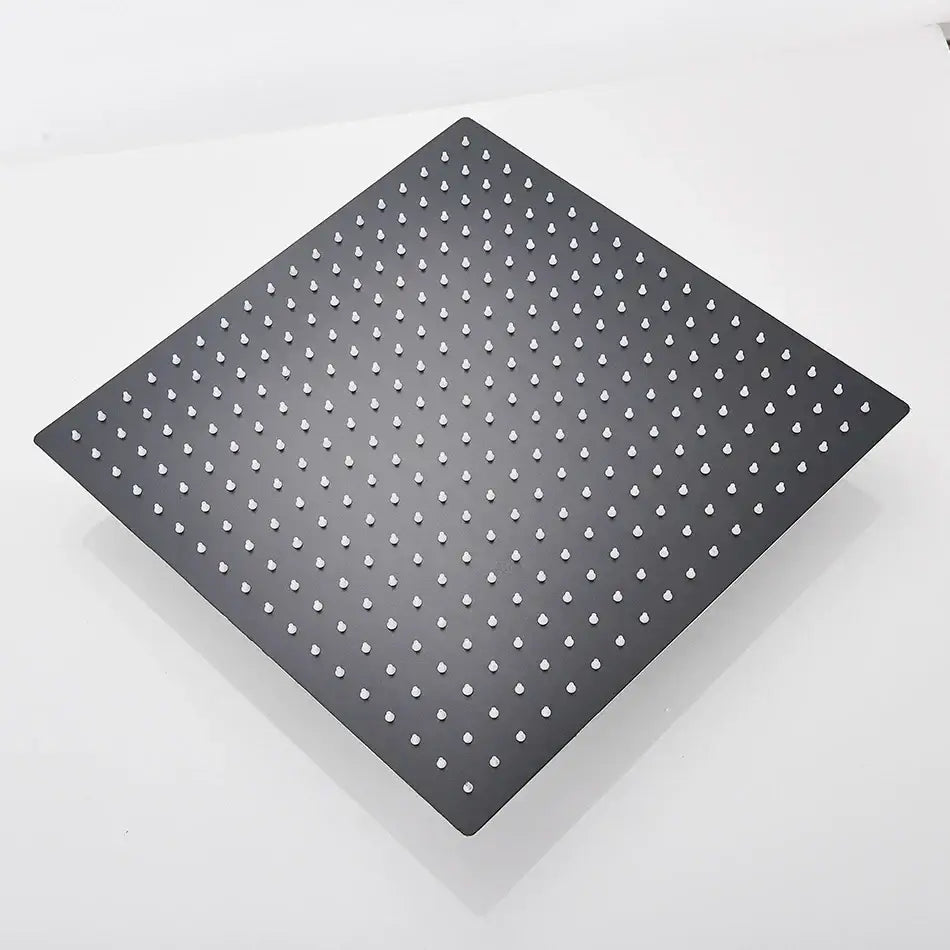 Modern matte black square rainfall shower head with evenly spaced white nozzles for an elegant rainfall shower experience