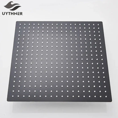 Modern matte black square rainfall shower head with black matte finish and white droplet-shaped nozzles grid