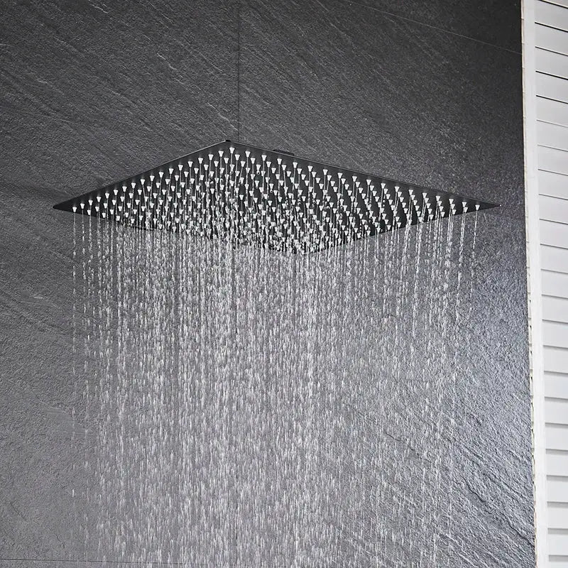Modern matte black square rainfall shower head with multiple water jets for a luxury bathroom fixture