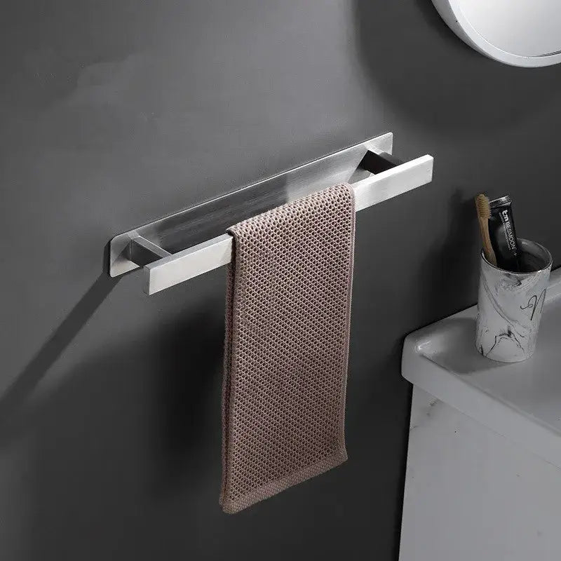 A modern matte black steel towel rack with a sleek rectangular design holds a taupe woven towel decorbites black steel towel hanger