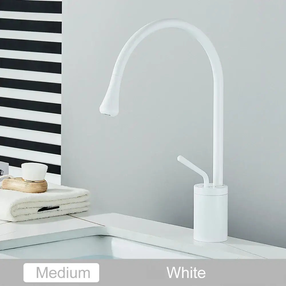 Modern matte black swivel waterfall basin faucet with sleek curved spout and cylindrical base for decorbites gold tall basin