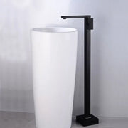 Modern matte black tall basin faucet with a sleek minimalist design paired with a white cylindrical pedestal sink