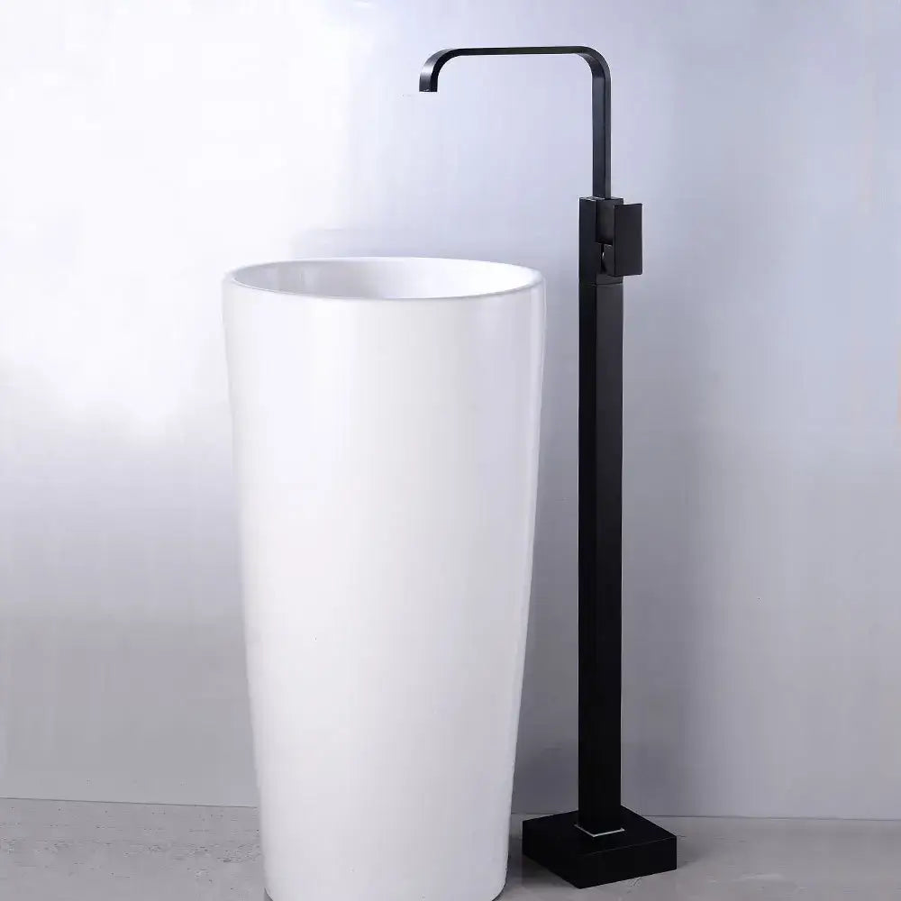 Modern matte black tall basin faucet installed on a white ceramic pedestal sink for bathroom decorbites black tall style